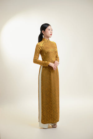 Áo dài gấm lụa Thái Tuấn họa tiết lá màu đồng