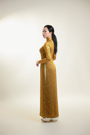 Áo dài gấm lụa Thái Tuấn họa tiết lá màu đồng